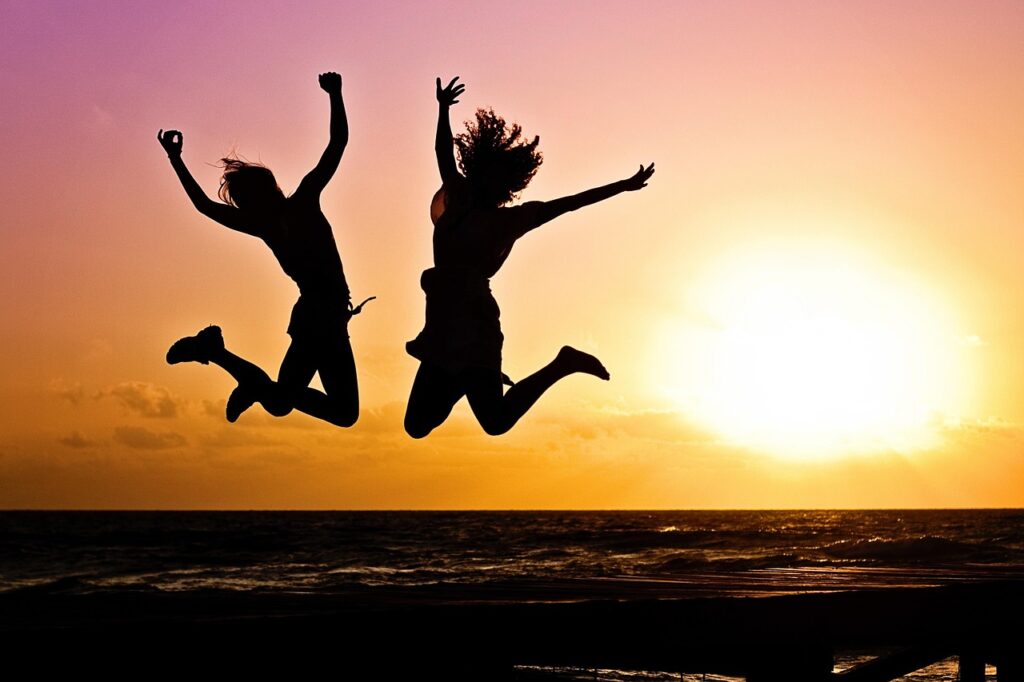 new year background, sunset, beach, silhouettes, jump, jumping, youth, active, happy, pair, girls, nature, young women, people, joy, freedom, seaside, dusk