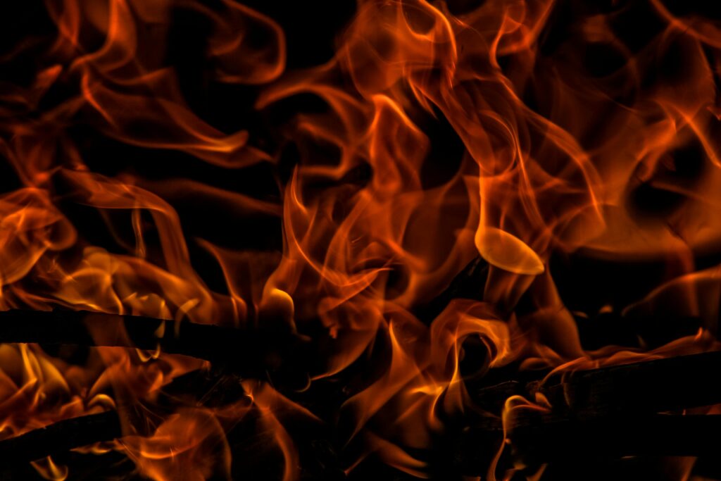 Close-up of vibrant flames creating a dramatic and intense warm glow.